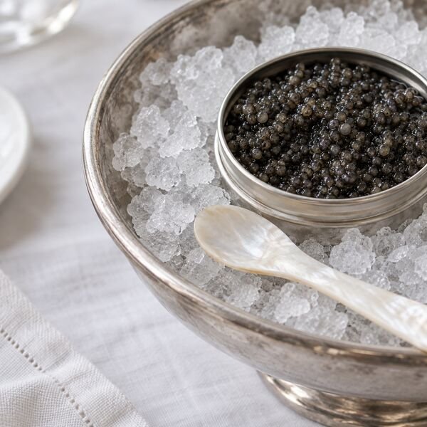 Caviar on ice with a mother-of-pearl spoon
